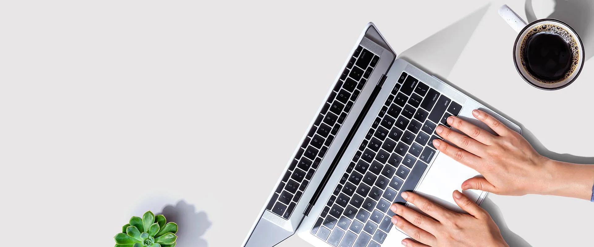 Small business owner reviewing documents at a desk.