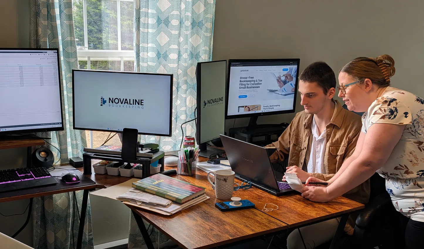 Small business owner reviewing documents at a desk.